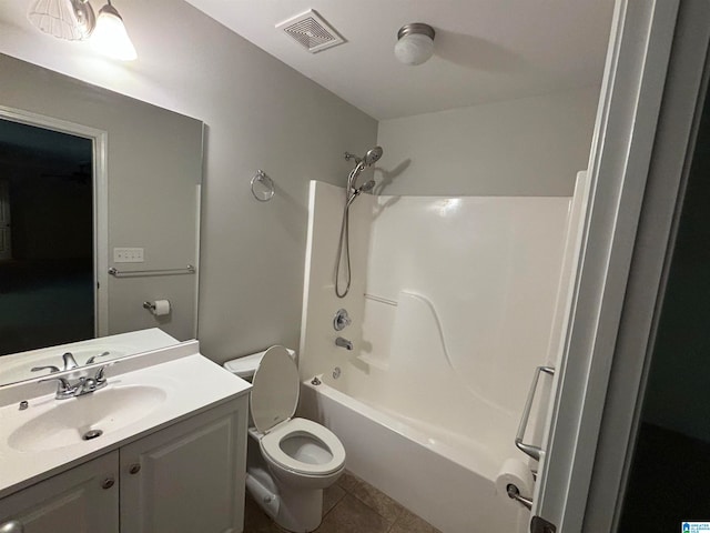 full bathroom with vanity, toilet, tile patterned floors, and washtub / shower combination