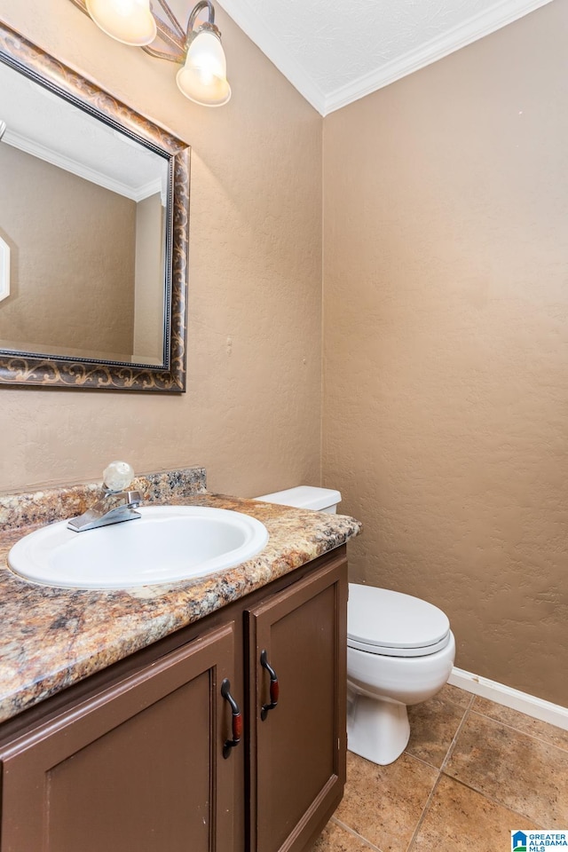 bathroom featuring crown molding, vanity, toilet, and tile patterned flooring