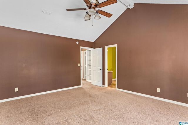 unfurnished room with light carpet, beamed ceiling, high vaulted ceiling, and ceiling fan