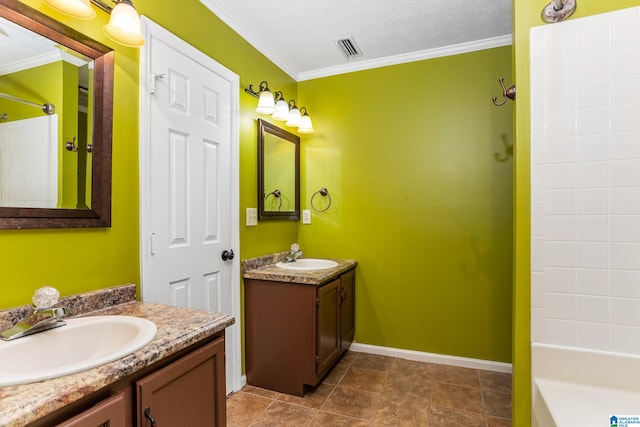 bathroom featuring tile patterned floors, ornamental molding, a textured ceiling, and vanity