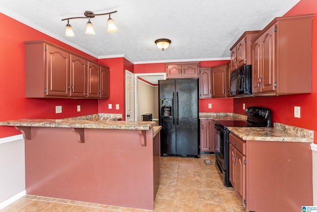 kitchen featuring a textured ceiling, black appliances, kitchen peninsula, and ornamental molding