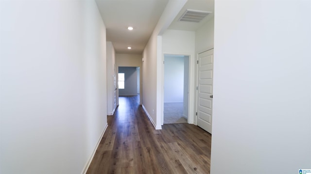 hallway featuring dark hardwood / wood-style flooring