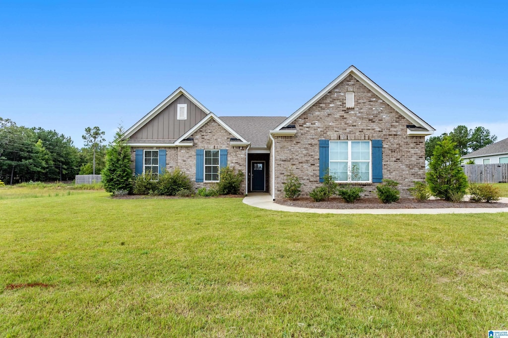 craftsman-style home with a front lawn