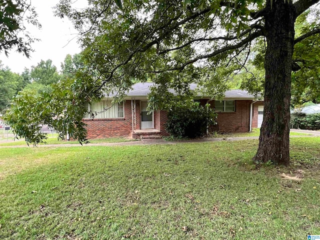 ranch-style home with a front lawn