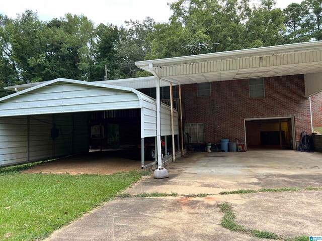 rear view of property with a carport