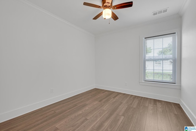 spare room with ornamental molding, hardwood / wood-style floors, and ceiling fan