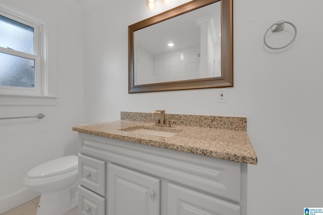 bathroom with tile patterned flooring, vanity, toilet, and a shower