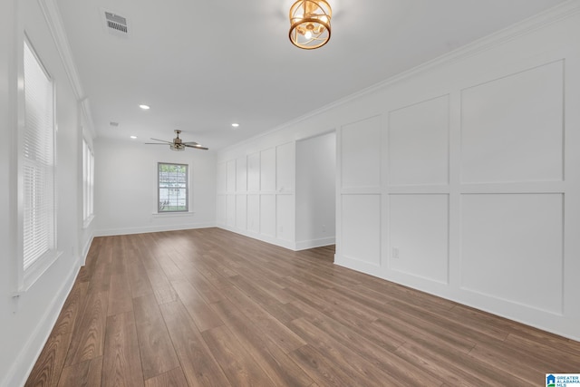 unfurnished room featuring ornamental molding, hardwood / wood-style floors, and ceiling fan