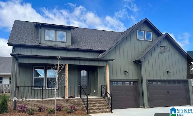 view of front facade with a porch and a garage