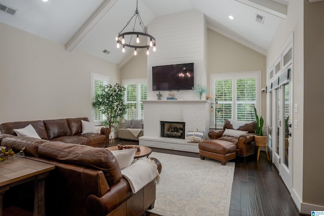 living room featuring dark hardwood / wood-style flooring, beam ceiling, high vaulted ceiling, and a chandelier