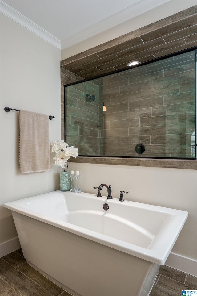 bathroom with independent shower and bath and crown molding