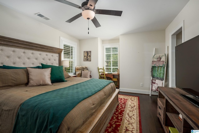 bedroom with dark wood-type flooring and ceiling fan