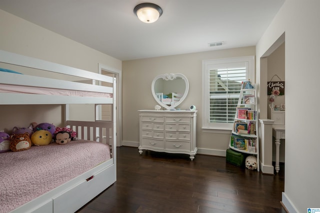 bedroom featuring dark hardwood / wood-style flooring