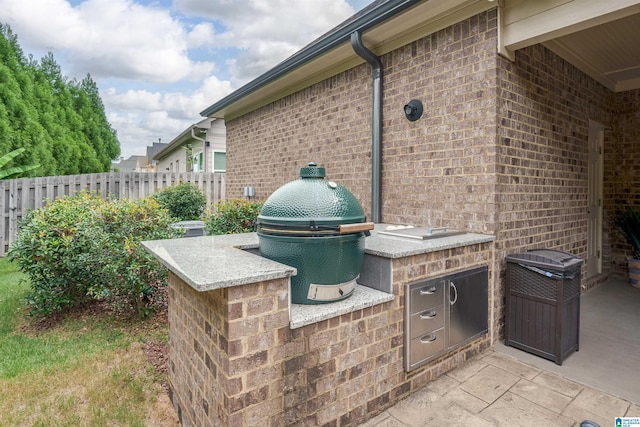 view of patio / terrace with exterior kitchen and grilling area