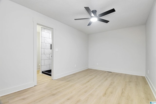 207 Friendship Cir, Clanton, AL 35045 - empty room with baseboards, ceiling fan, and light wood finished floors