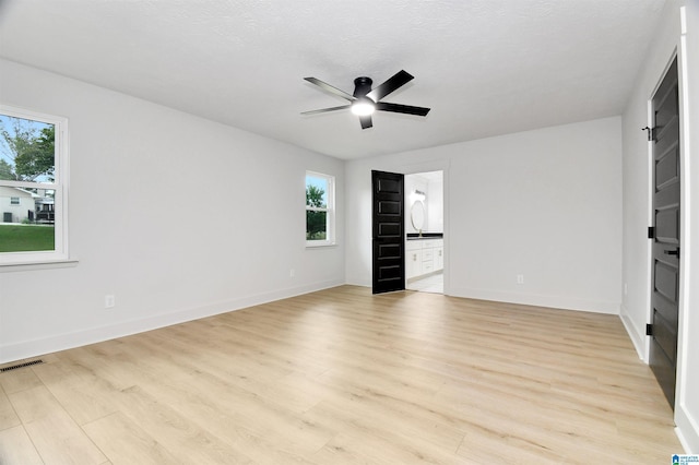 207 Friendship Cir, Clanton, AL 35045 - spare room featuring light wood-style flooring, visible vents, baseboards, and ceiling fan
