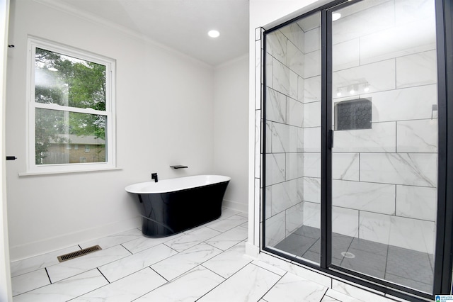 bathroom with separate shower and tub and ornamental molding