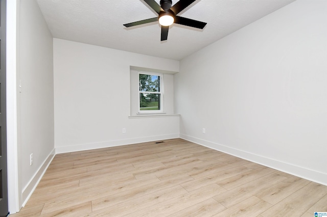207 Friendship Cir, Clanton, AL 35045 - unfurnished room with light wood finished floors, baseboards, visible vents, and ceiling fan