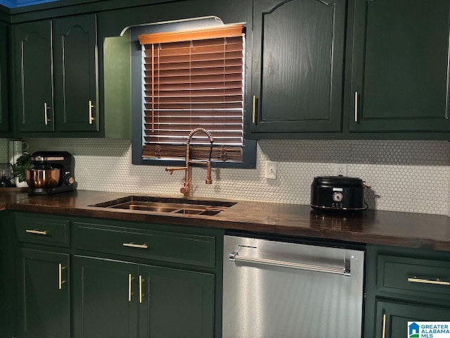 kitchen featuring green cabinets, dishwasher, tasteful backsplash, and sink