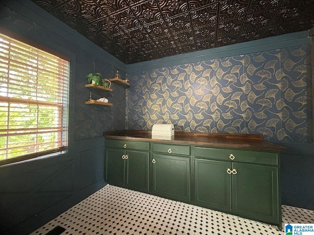 interior space featuring a wealth of natural light and green cabinetry