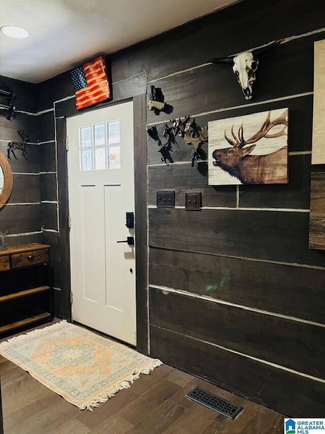 foyer with wood-type flooring