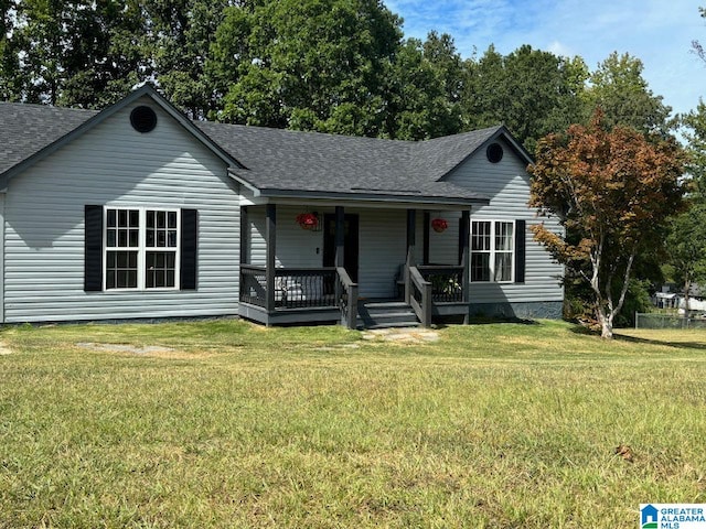 ranch-style home with covered porch and a front yard