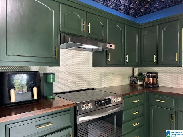 kitchen featuring green cabinetry, electric stove, and wooden counters