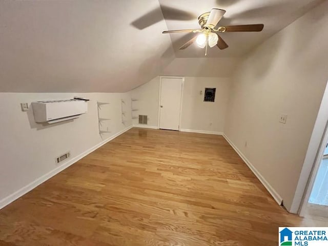 bonus room featuring light hardwood / wood-style flooring, ceiling fan, and vaulted ceiling