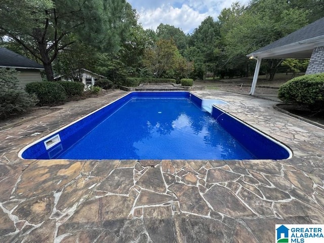 view of pool with a patio area