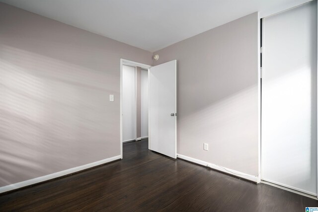 empty room featuring dark hardwood / wood-style floors