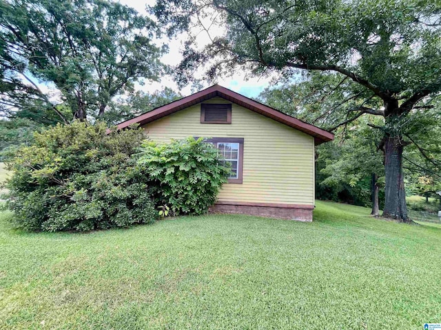 view of home's exterior with a yard