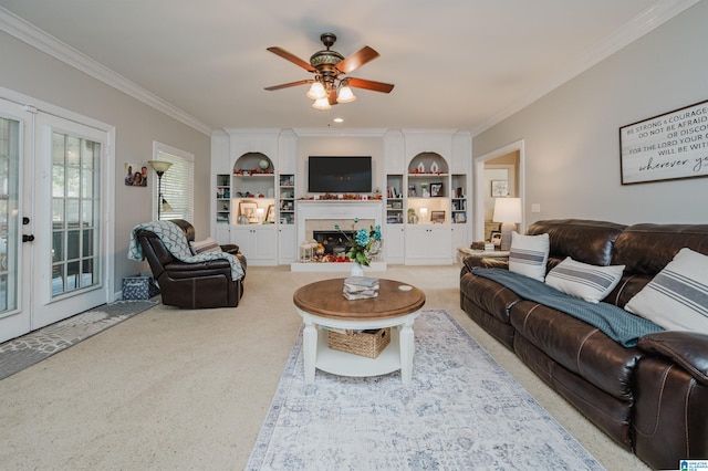 living room featuring ceiling fan, crown molding, and french doors