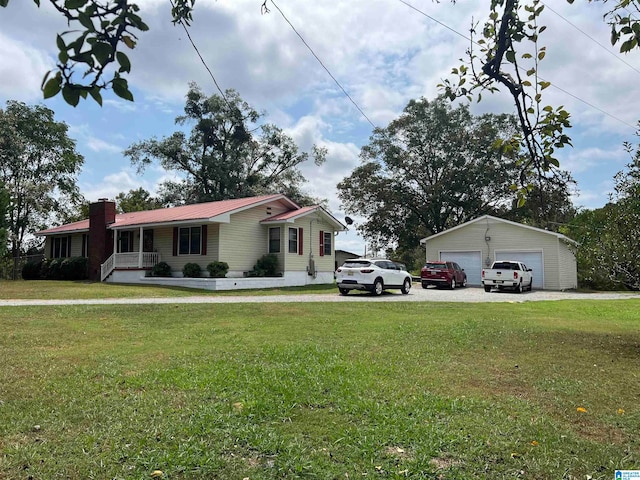 view of front facade with a garage, an outdoor structure, a porch, and a front lawn