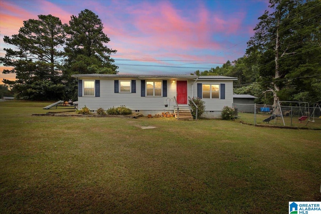 view of front of house with a lawn