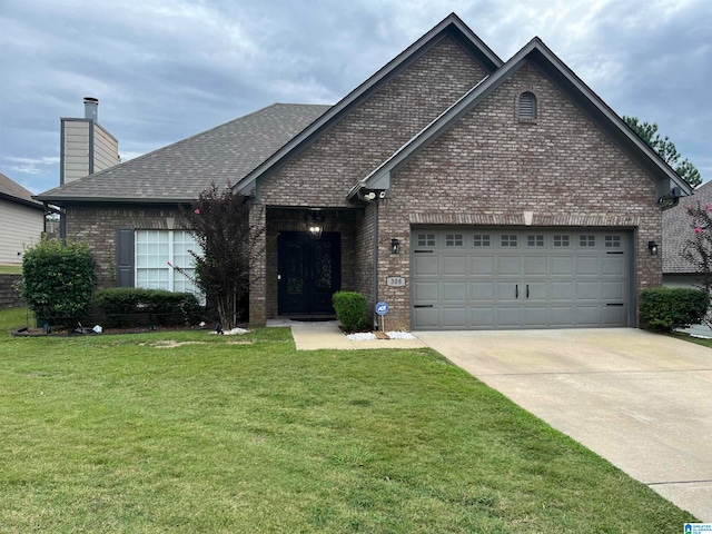 view of front facade featuring a front yard and a garage