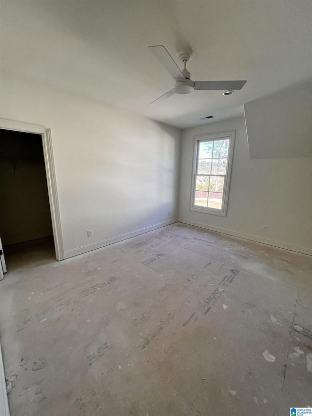 interior space with ceiling fan