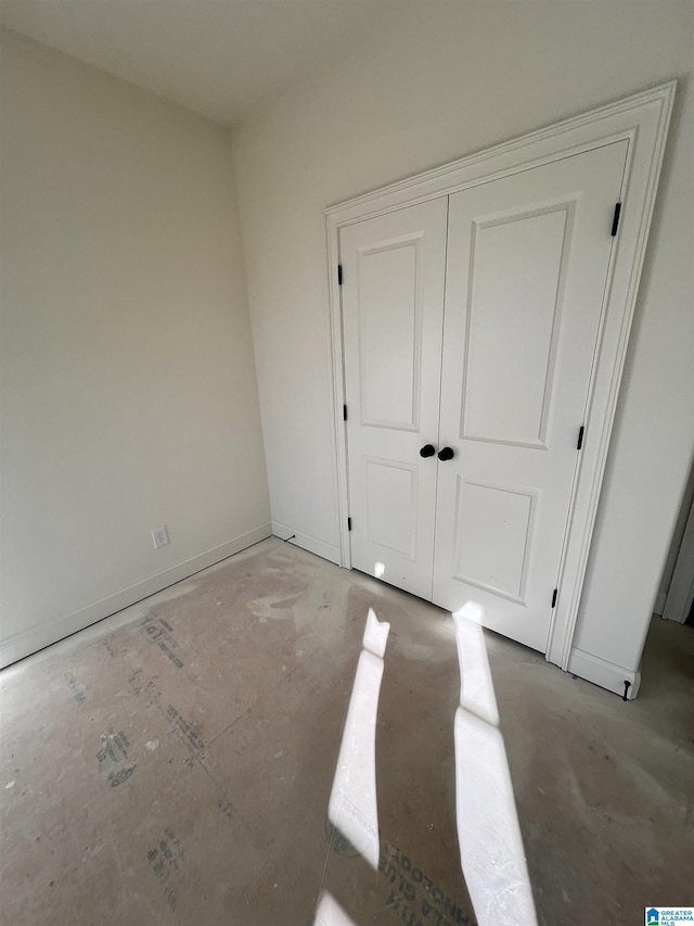 unfurnished bedroom with a closet