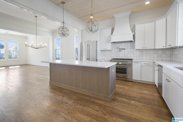 dining room with beamed ceiling, ceiling fan with notable chandelier, wood-type flooring, and ornamental molding