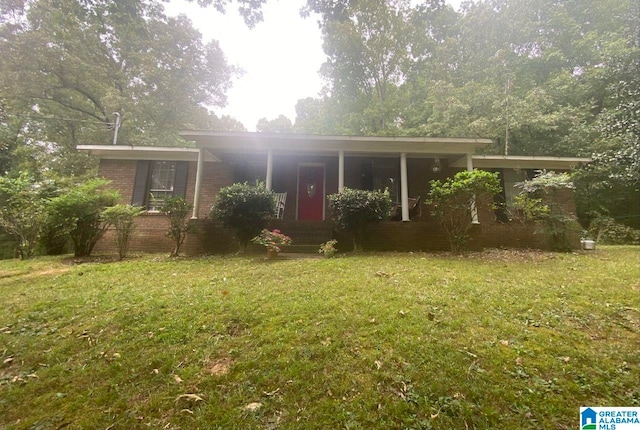 ranch-style home with brick siding, a front yard, and a porch