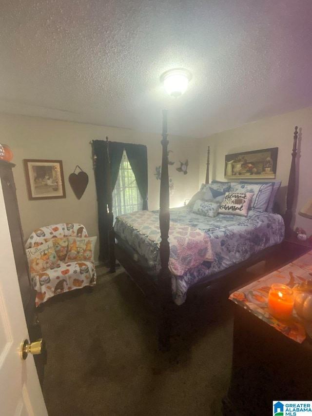 carpeted bedroom with a textured ceiling