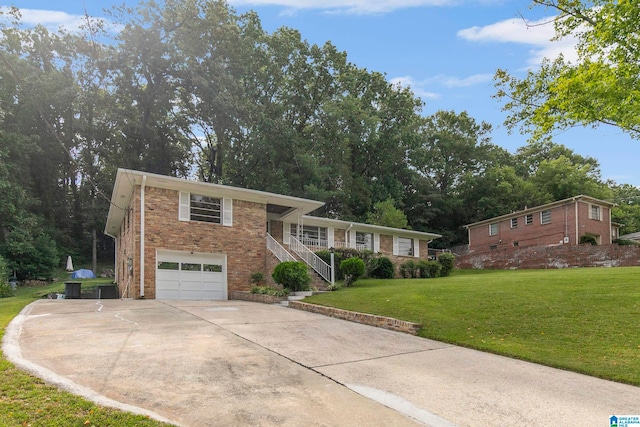 tri-level home with a garage and a front lawn