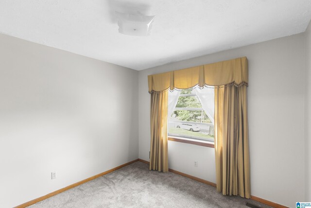 empty room with ceiling fan and wooden walls