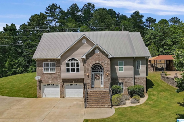 bi-level home with a garage and a front yard