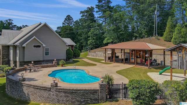 view of pool with a gazebo, a yard, and a patio area