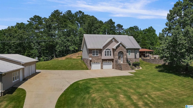 view of front of home featuring a garage and a front yard