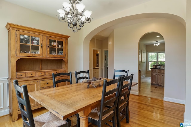 dining room featuring a notable chandelier and light hardwood / wood-style floors