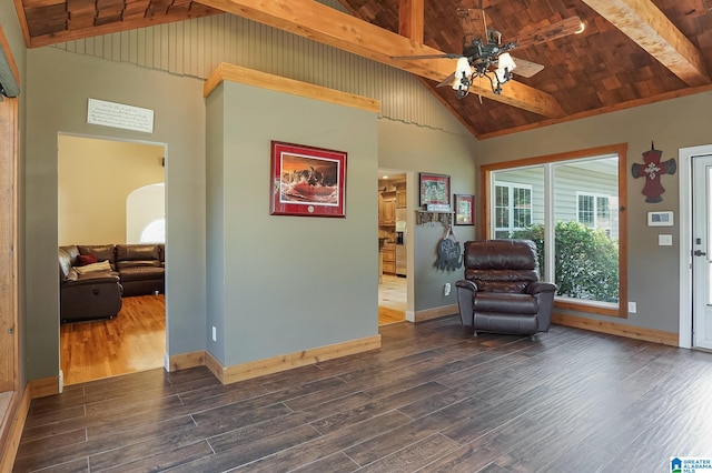 sitting room with dark hardwood / wood-style floors, wooden ceiling, beam ceiling, high vaulted ceiling, and ceiling fan