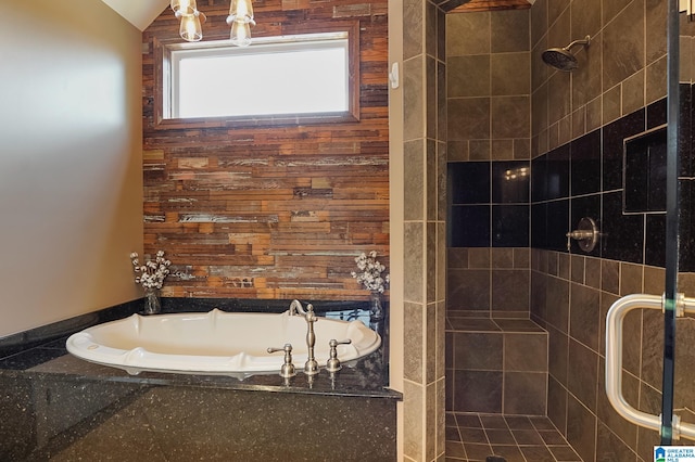 bathroom featuring lofted ceiling and shower with separate bathtub