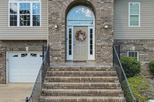 view of exterior entry with a garage