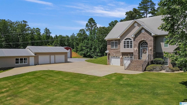 view of front facade with a garage and a front lawn